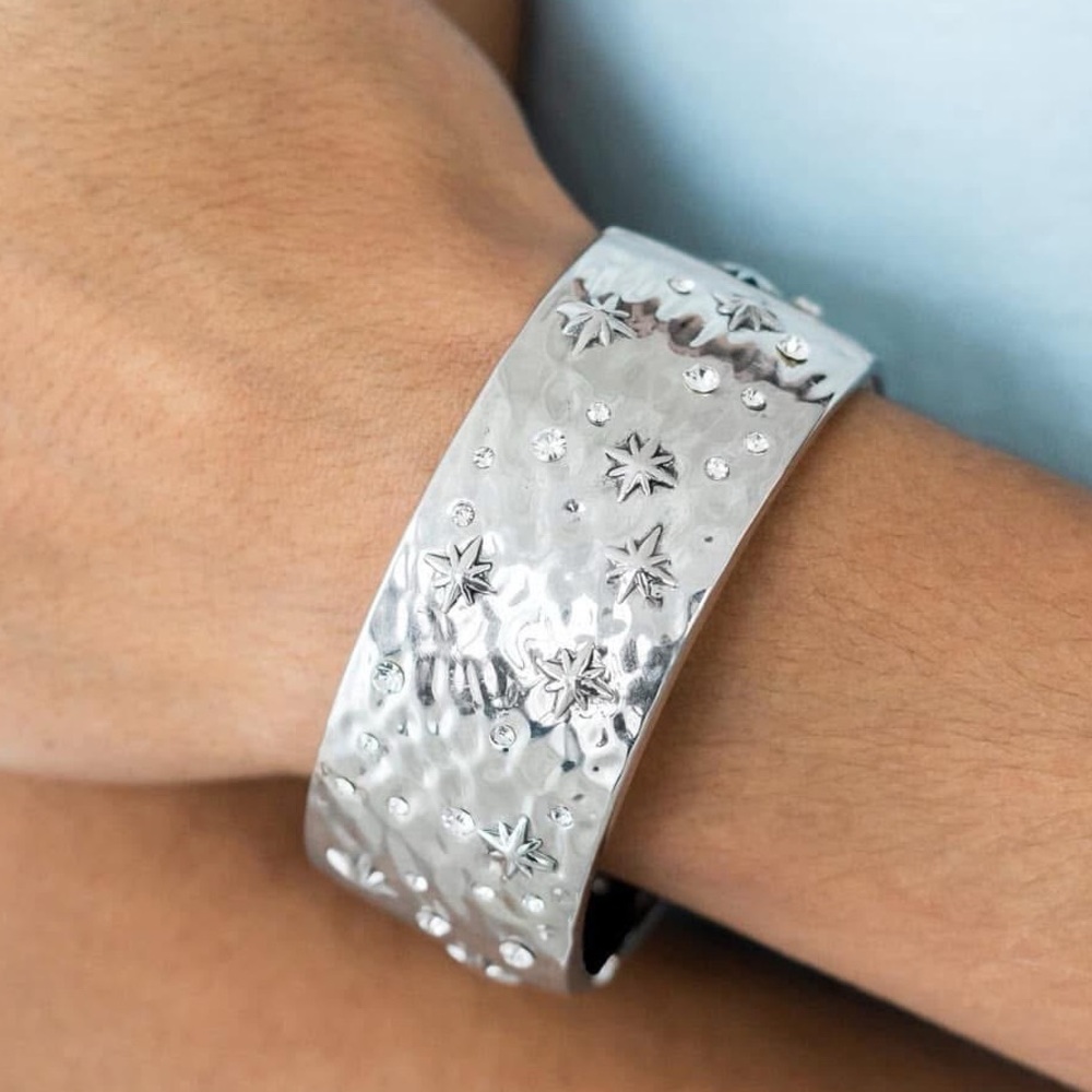 Hinged silver cuff bracelet with star design